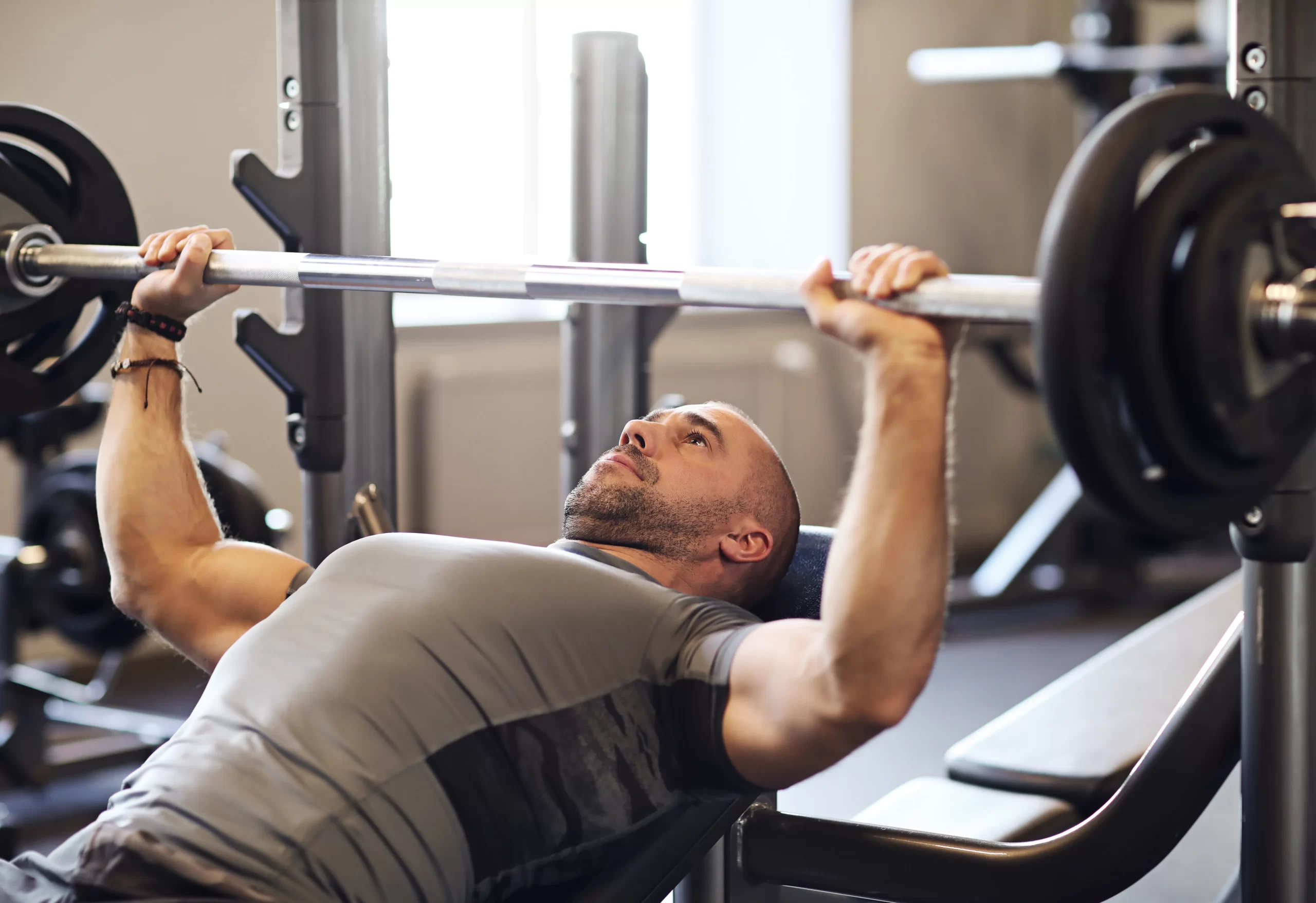 man-strength-training-with-barbell-in-gym-2026-03-25-06-45-31-utc
